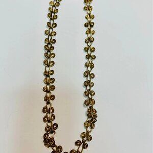 Gold tone Metal swirled necklace